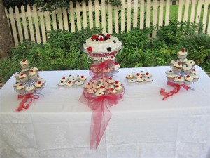 Wedding cake and cupcake table setting