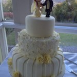 Swirls and stripes - ivory wedding cake with handmade champagne roses, bride and groom toppers (design - customer request)