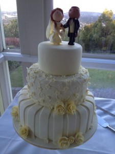 Swirls and stripes - ivory wedding cake with handmade champagne roses, bride and groom toppers (design - customer request)