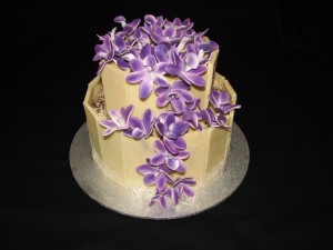 Marbled chocolate shard wedding cake with Singapore Orchids